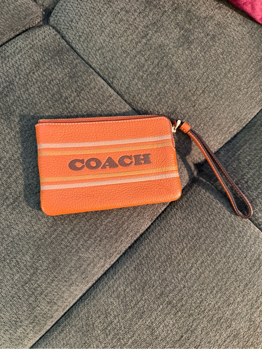 Coach Orange Leather Zip Wristlet with Brown Strap and Stripe Logo